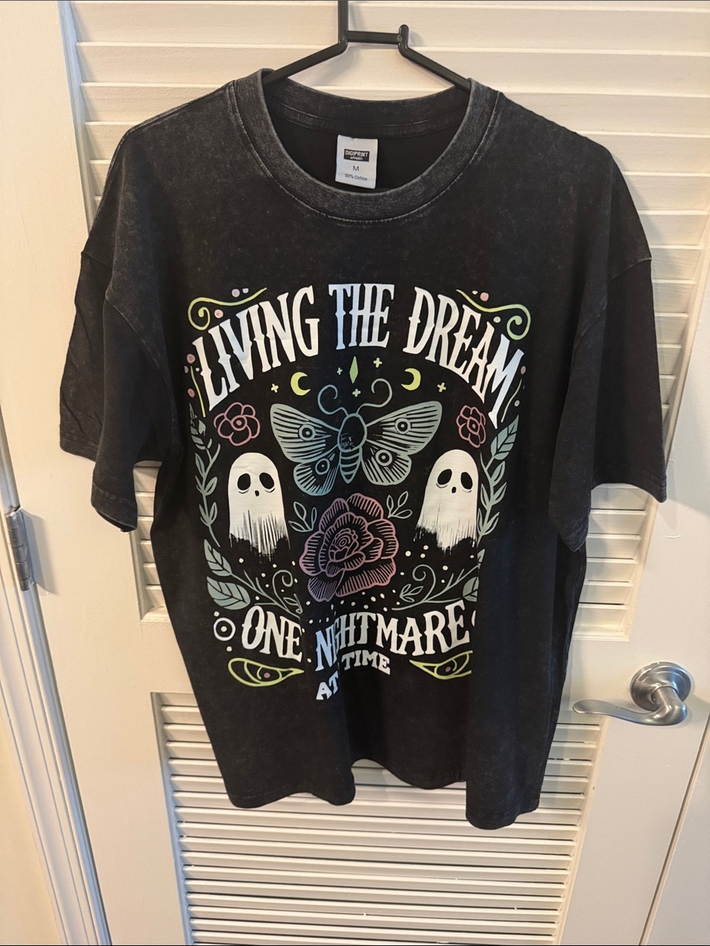 Vintage-inspired Black mineral-wash tee by-Digiprint feature "Living the Dream,